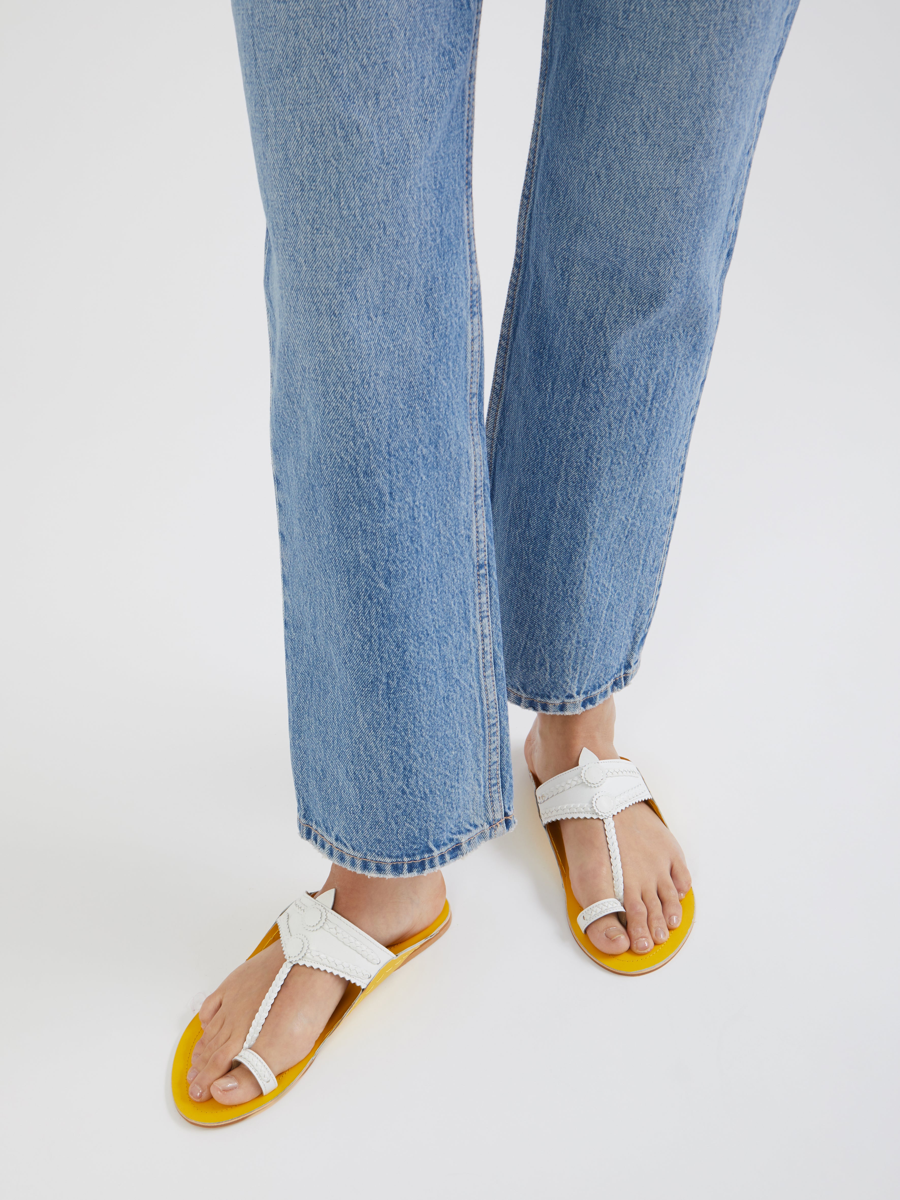 Kolhapuris flat sandals, handcrafted, india, traditional artisanal techniques, slip-on, heritage design, Kolhapuri style, pop colors, modern twist, iconic shape, leather sandals, cultural craftsmanship, relaxed fit, sandali in pelle, sandali indiani, summer shoes, scarpe estive
