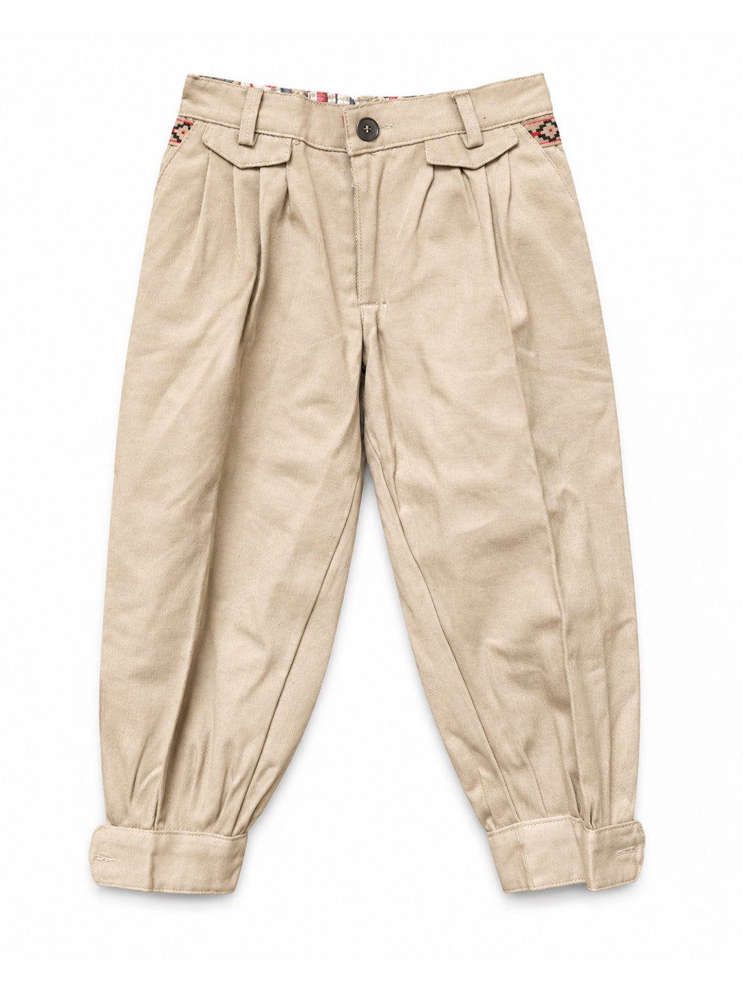 A pair of beige pleated trousers with cuffed hems, laid flat on a white background. Argentine Bombacha Pants, horseback riding, traditional gaucho, Argentine cowboy attire. Soft and breathable fabrics, perfect pants for all-day wear. With a loose fit and elasticated waistband, they allow for plenty of movement, while the high waist provides extra coverage. Everyday look, perfect for both urban and countryside adventures. Cotton Corduroy, KIDS, PANTS, KIDSWEAR, BOTTOM, KIDS PANTS