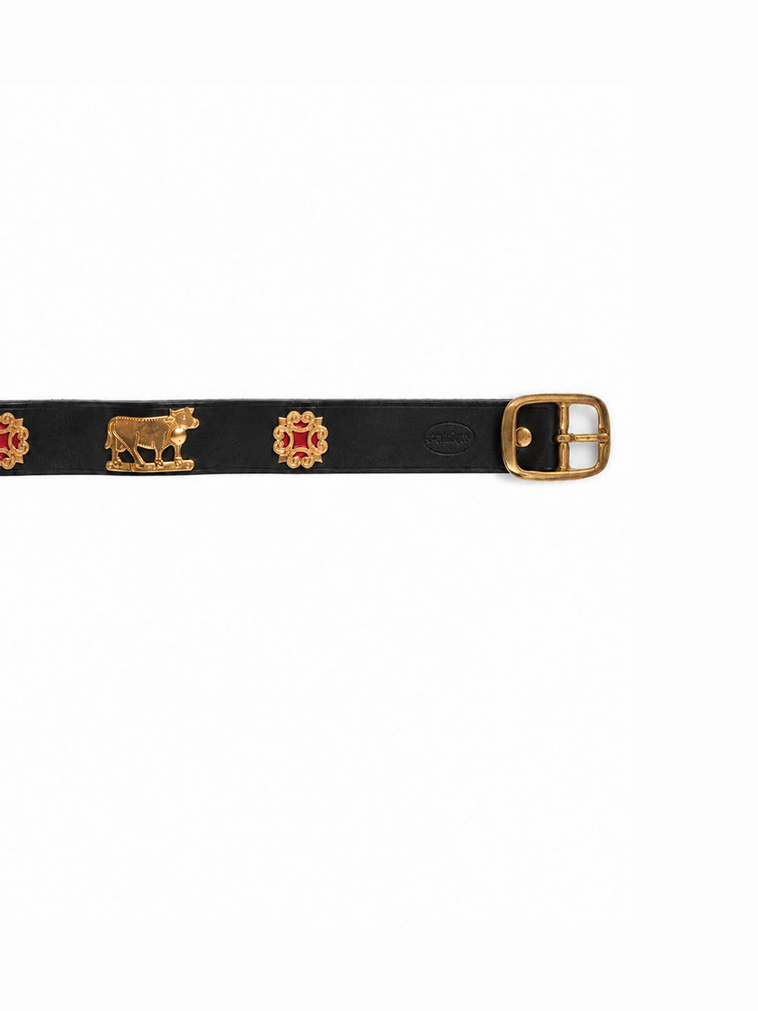 A black leather belt featuring gold-tone metal studs with red and gold enamel details, including a cow motif and a square buckle, shown against a plain white background. The Alpine Belt, Appenzeller belt, made in Switzerland, handmade, mountain belt, leather belt, cintura di pelle, cintura con le mucche, stelle alpine, cintura svizzera, cintura tirolese, cintura ampezzana, traditional belt, cow belt, kids belt, artisanal kids belt, artisanal belt, cinture da bambini, cinture artigianali.