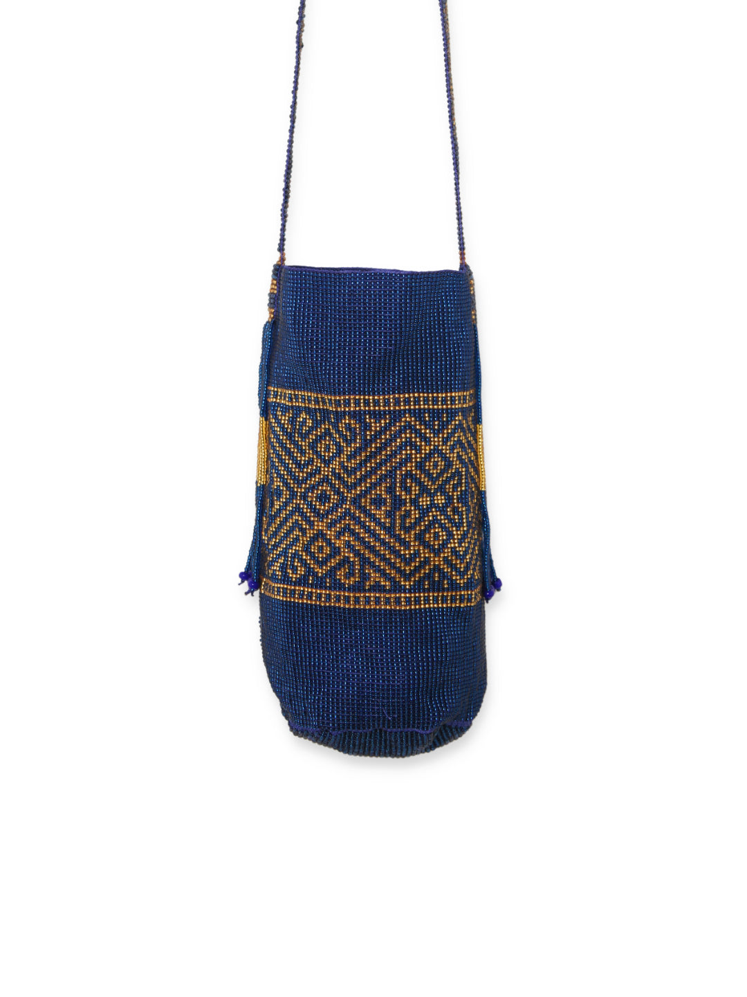 This Mochila bag is entirely hand-woven with glass beads by artisans of the Kamsa tribe on the southern rain forest of Colombia where culture is one of their biggest treasures. Each of these beaded Mochila represents a special belief, for instance, here is represented the ant, symbol of work and harmony to work. Black with gold decorations 100% glass beads Beaded drawstring closure. Evening bag.